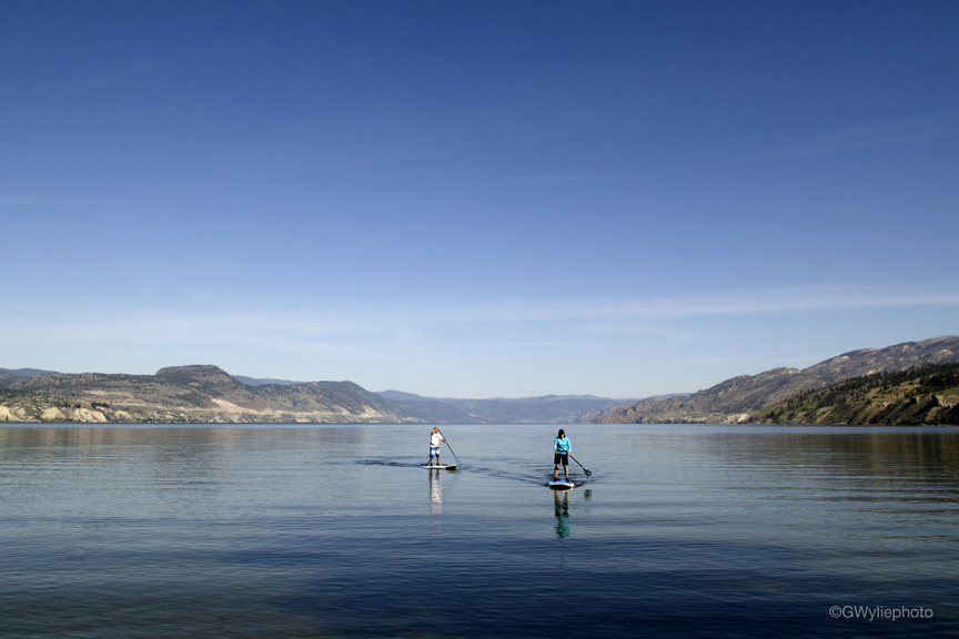 Early morning stand up paddlers Okanagan Lake